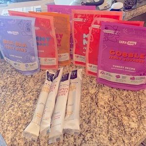 BarkBox Treat Bundle: 7 BarkBox dog treat bags and 4 Chew Sticks.